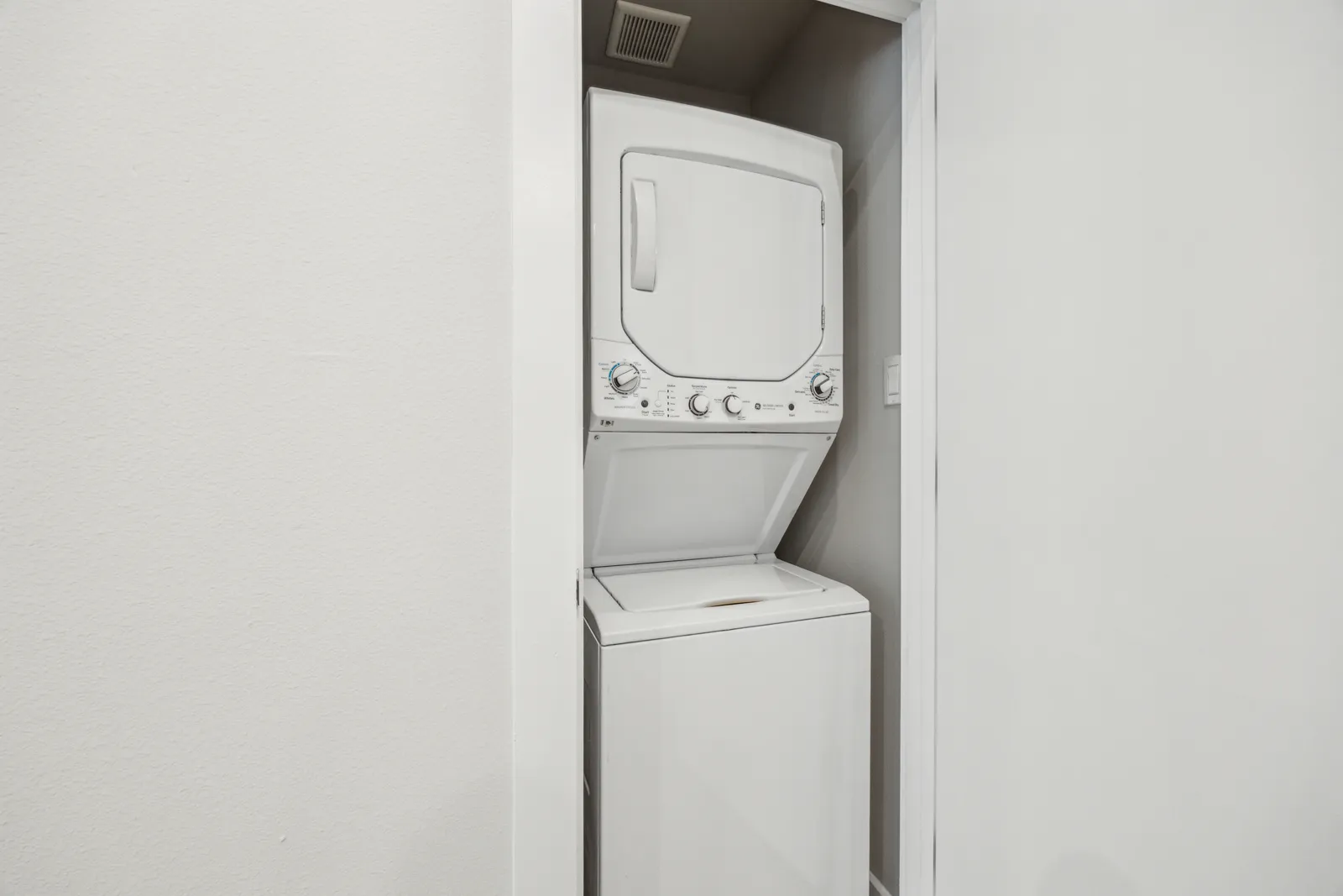 In-unit stacked washer and dryer